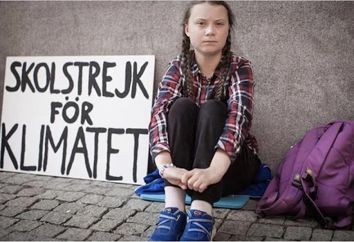 Greta Thunberg during her school strike for climate outside the Swedish Parliament in Stockholm