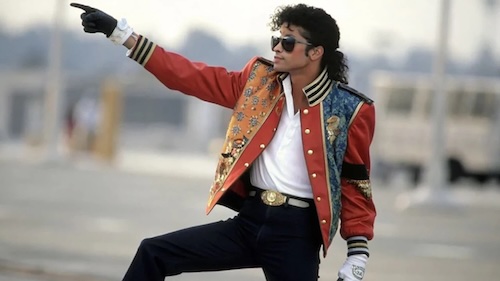 Michael Jackson performing one of his iconic dance moves